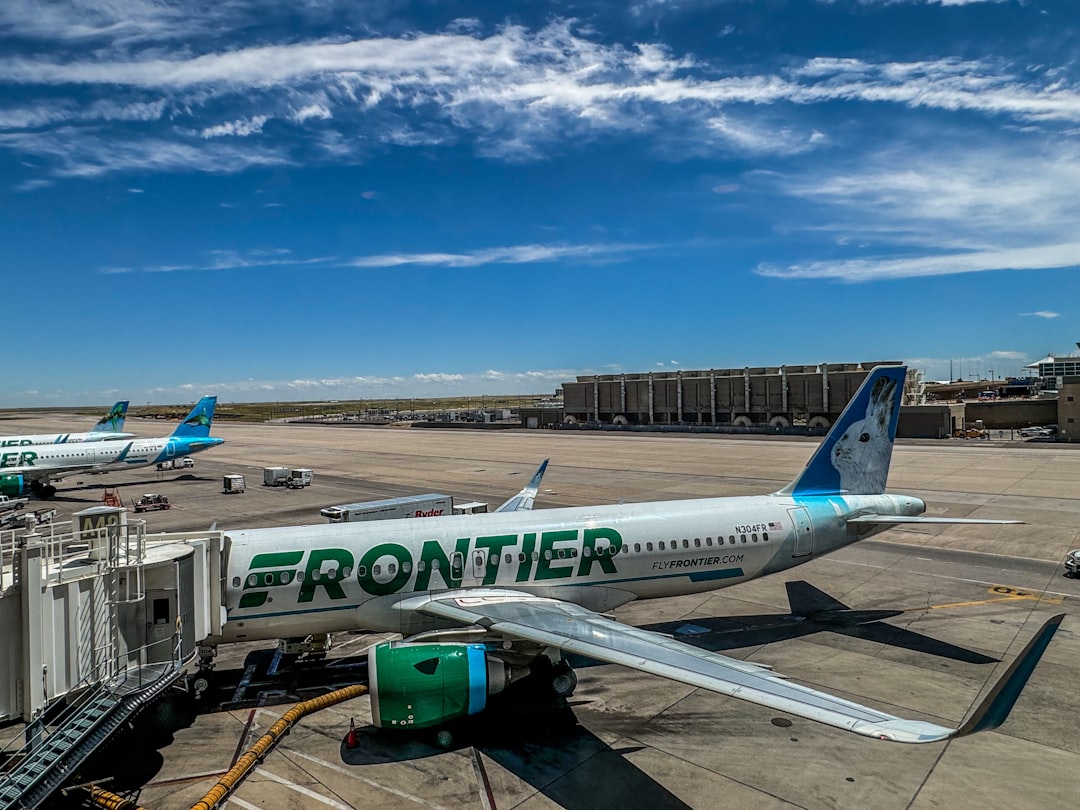Frontier Airlines parked at Concourse A. Denver International Airport.